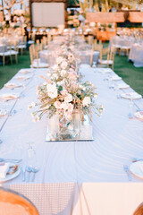 elegantly decorated table at a wedding reception with beautiful sunset