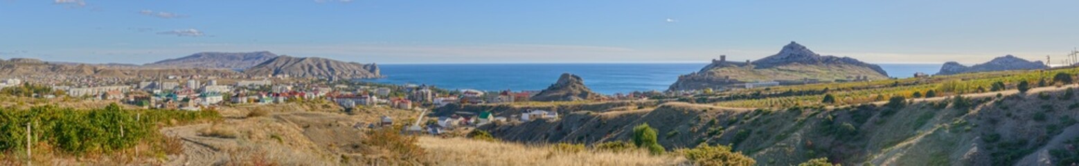 Fototapeta na wymiar Panorama of Sudak location coastline with Genoese fortress, Crimea, Russia.