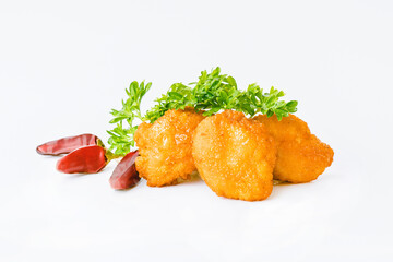 Chicken Breaded Fillet.Fast food. Breaded Chicken Inner Fillet on a White Background,Chicken Breaded Raw Meat. Fast cooking. Breaded chicken nuggets. Homemade food at home.