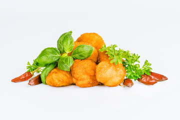 Fast homemade food at home. Breaded chicken nuggets.Breaded Chicken Inner Fillet with green lettuce leaves on a White Background.Chicken Breaded Raw Meat,Fillet.Chicken breaded schnitzels.Fast cooking