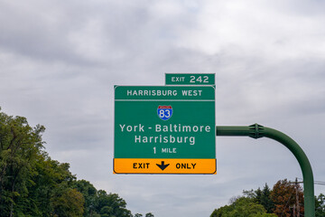 Exit 242 sign on I-76 Pennsylvania Turnpike for Interstate 83 toward York - Baltimore or Harrisburg