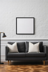 Frame mockup poster on white brick wall above dark gray leather couch, front view. Minimalist interior with picture and decor. Concept of elegant home design, modern living room