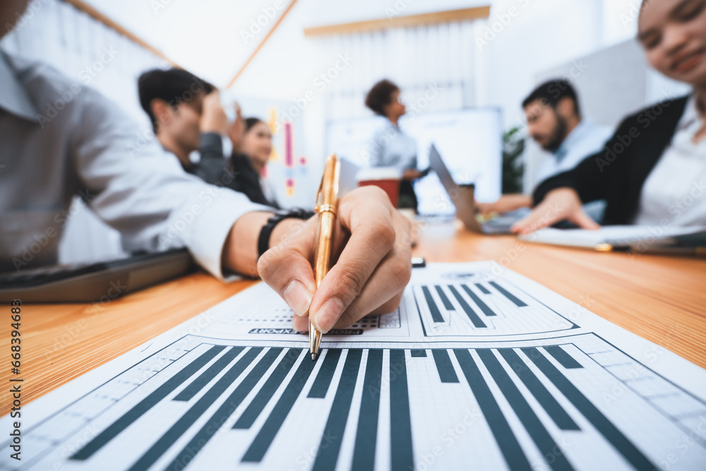 Poster focus financial dashboard paper showing graphs and chart with blurred background of diverse business