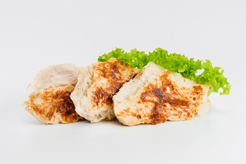 Chicken fillets fried until half cooked, semi-finished product with fresh herbs on a white background. Fast cooking.Fast homemade food.Fast food. Quick cooking at home. Copy space.