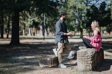 Fototapeta premium Cheerful friends enjoy carefree conversation in a sunny city park. Surrounded by nature, they have fun, relax, and add positive energy to their leisure time.