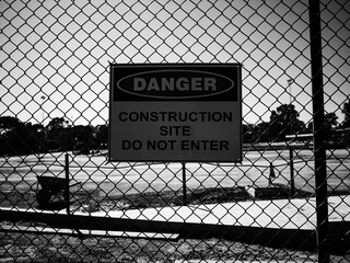 wire fence with danger sign