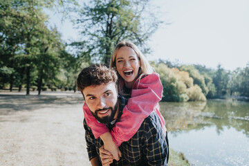 Male person giving piggyback ride to his girlfriend.