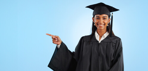 Graduate, studio portrait or happy woman point at school registration, university ads or college information, choice or academy. Mockup space, education and graduation notification on blue background
