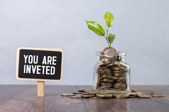 paper with text YOU ARE INVETED. Business concept.