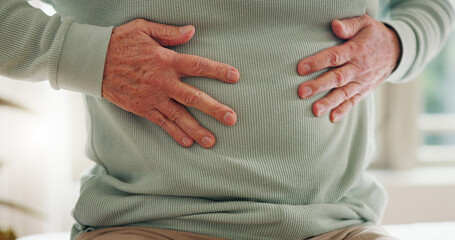 Hands on stomach, closeup and gut health, digestion and nutrition with elderly care and person has...