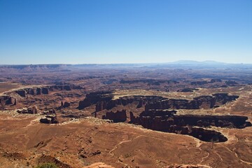 Canyonlands National Park offers breathtaking views of eroded canyons, rocky mesas and strange buttes in the area where the Green River and Colorado River meet in their canyons far below