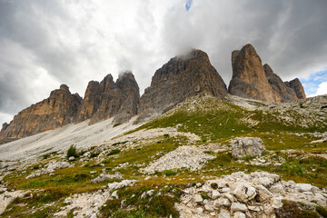 Fototapeta premium Breathtaking scenery featuring rocky mountain peaks on sunny summer day. Enchanting nature of Dolomites, Italy..
