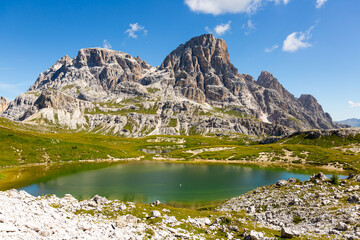 Summer sunny day at Dolomitic Alps: turquoise hue see-through water of Laghi dei Piani