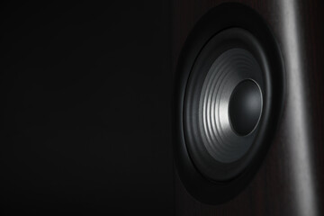 One sound speaker on black background, closeup. Space for text