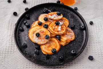 Pancake with blueberry and honey topping