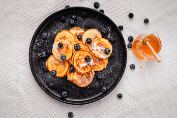Pancake with blueberry and honey topping
