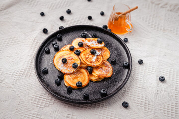 Pancake with blueberry and honey topping