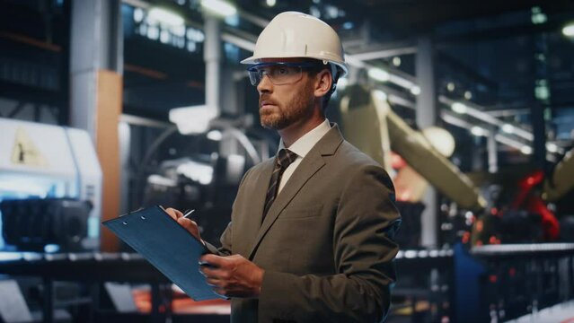 Serious supervisor checking manufacturing process at production alone close up.