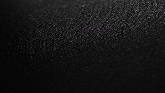 Dolly panorama on black and gray factory fabric. The shot is perfect for the background in your projects. Here you can place text or logo.