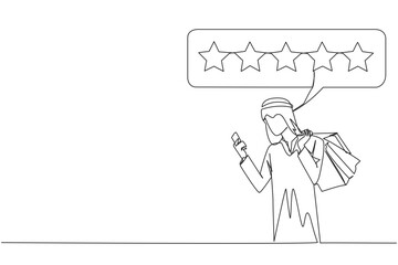 Single one line drawing happy Arabian man holding several shopping bags. The other hand typing on the smartphone gives a 5 star review. Online shopping. Continuous line design graphic illustration