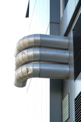 air ducts on the facade of a building, gas heating turbo boiler. bottom-up view.