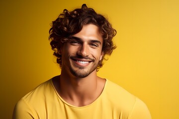 portrait of a happy man on a yellow background