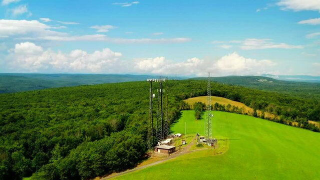Scenic aerial view of cell towers in the countryside. 