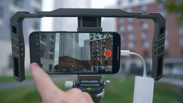 Professional shooting on phone with memory card. Action. External disk for recording material from phone. Shooting on phone with stabilizer and external memory