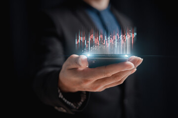 investment and finance concept, businessman holding virtual trading graph and blurred light on hand, stock market, profits and business growth.