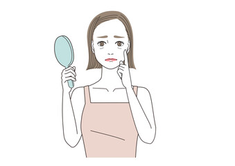 目尻の小じわを気にしている女性