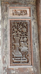The old wooden windows view with the beautiful carved sculpture in China