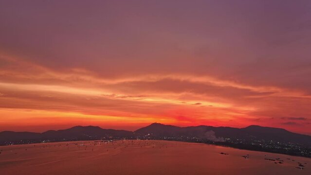 .aerial hyperlapse view amazing red sky in colorful sky above the island..Majestic sunset or sunrise landscape Amazing light of nature background. .gradient color texture fantastic sky texture.