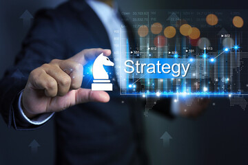 Business strategy conconcept with horse chess in businessman hand represent to planning and tactic to make profit in global scale trading market
