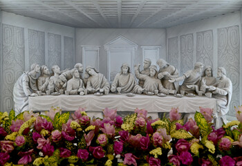 BANGKOK, THAILAND – OCTOBER 26, 2023: A marble statue with carving of the Last Supper in...