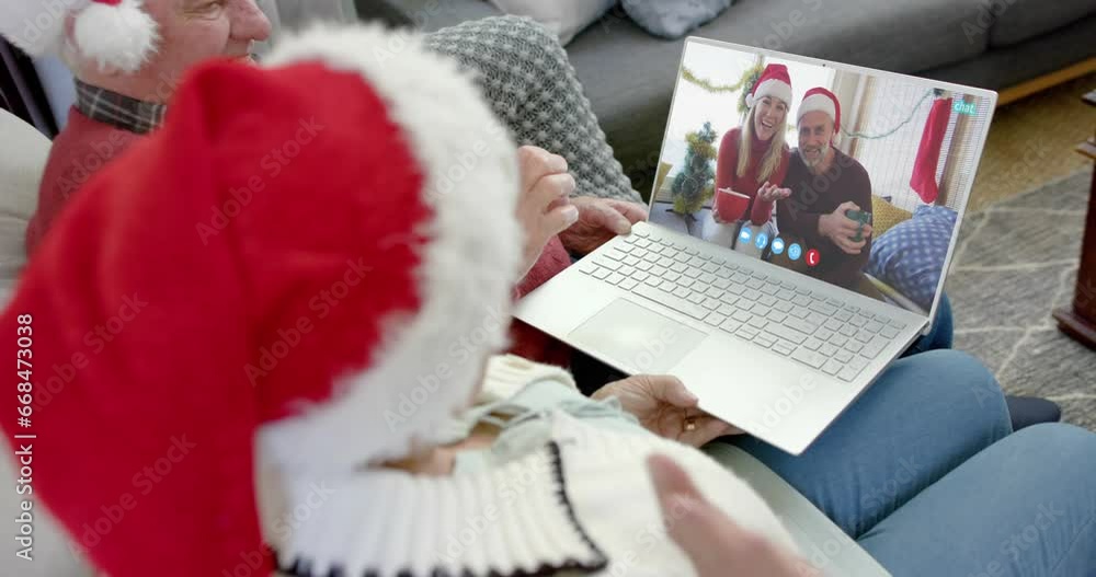 Canvas Prints Two happy caucasian couples having christmas laptop video call, slow motion