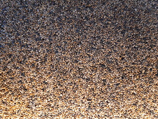 Warm illumination Pebble resin stone finish texture