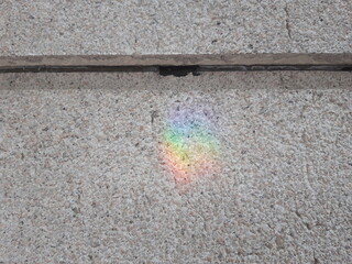 Rainbow reflected in granite detail view simple img