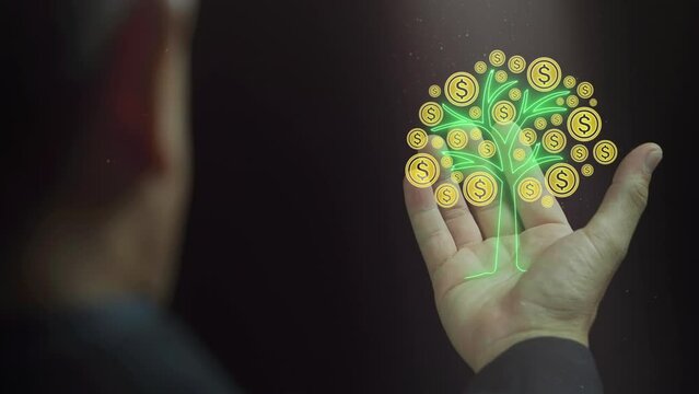A man is looking to a dollar coin tree on his palms. Financial investment concept.