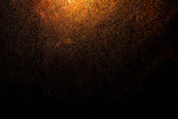 Fototapeta na wymiar Black dark orange red golden brown shiny glitter abstract background with space. Twinkling glow stars effect. Like outer space, night sky, universe. Rusty, rough surface, grain.