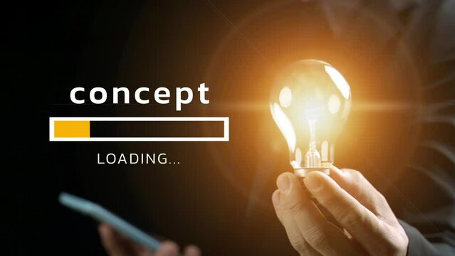 The concept is loading with a business man is holding smart phone and a lighted lightbulb on his hand.