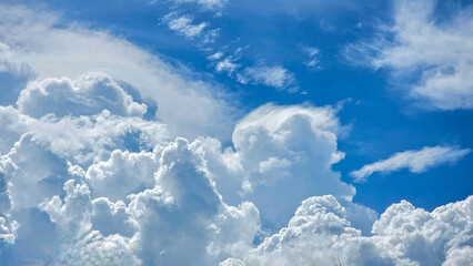 White fluffy clouds in the blue sky. Beautiful blue sky with white clouds. Beautiful sky cloud background in sunny day. Blue sky and big clouds.