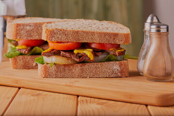 Beef steak sandwich made with sour dough bread.