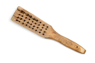 An old wooden brush with no bristles. Old construction brush on white background.
