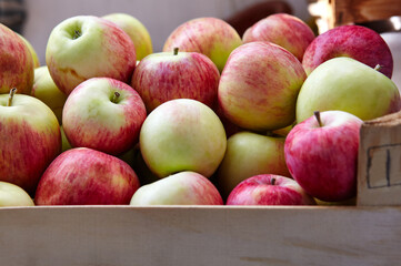 Wooden crate box full of fresh apples. Overhead view of fresh organic apples harvesting concept