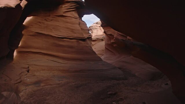 Gimbal shot moving through slot canyon