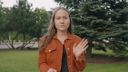 Young caucasian woman claps sarcastically in her hands, rude