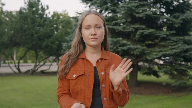 Young caucasian woman claps sarcastically in her hands, rude