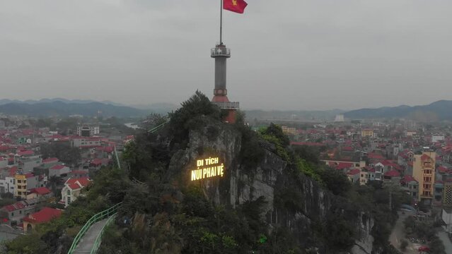 Tilt up shot of big Vietnamese flag at lang son city, aerial