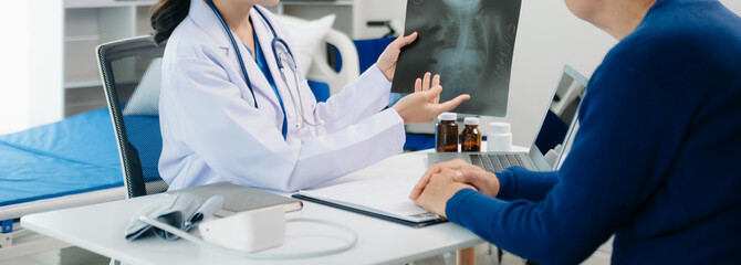 Female doctors, specialists in treatment, make an appointment to meet patients after x-ray and...