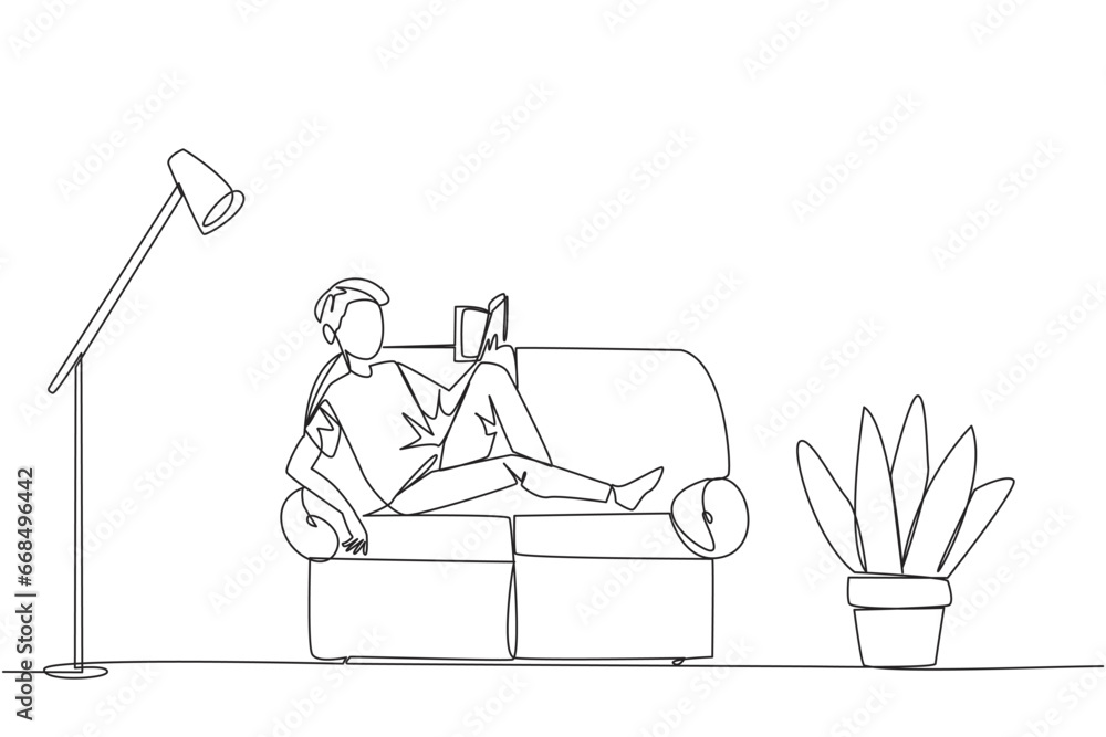 Poster single continuous line drawing man sitting stretched out on the sofa reading book. really like the c